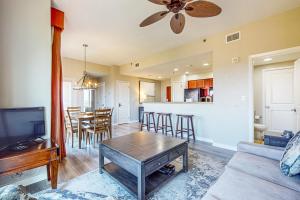 a living room with a couch and a table at Luau I 6710 in Destin
