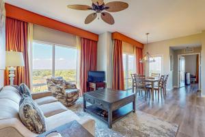 a living room with a couch and a table at Luau I 6710 in Destin