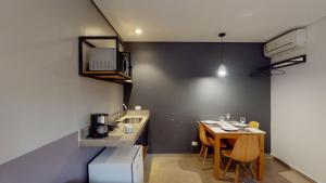 Η κουζίνα ή μικρή κουζίνα στο Apartamento 4 Pinheiros Incrível