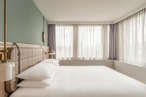 Ένα ή περισσότερα κρεβάτια σε δωμάτιο στο Zurich Marriott Hotel