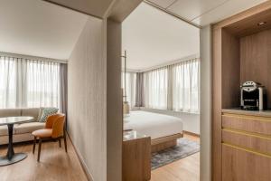 Ένα ή περισσότερα κρεβάτια σε δωμάτιο στο Zurich Marriott Hotel