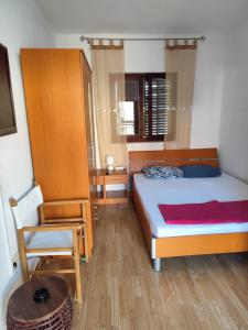 Postel nebo postele na pokoji v ubytování Tijana + 2 fotografie