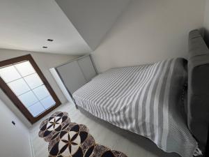 a bedroom with a bed and a window at Relax 1 Lüks villa in Kemer +14 photos