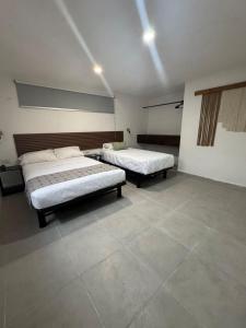 Postel nebo postele na pokoji v ubytování Margaritas Cincuenta