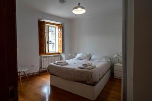 Posteľ alebo postele v izbe v ubytovaní Apartamento Sarmiento- Casco histórico Mondoñedo + 13 fotografií