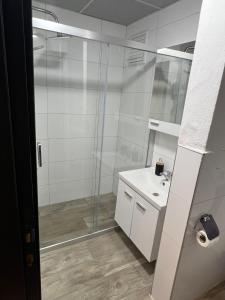 a bathroom with a glass shower and a sink at Ada Park Hotel in Kusadası +71 photos