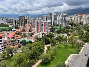 an aerial view of a city with buildings and trees at Mirador del Parque in Cochabamba