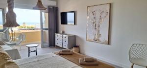 a bedroom with a bed and a view of the ocean at Sun&Ocean in Morro del Jable