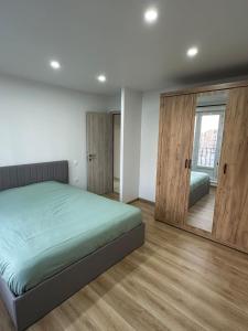 Ένα ή περισσότερα κρεβάτια σε δωμάτιο στο Appartement Le Doux Rivage