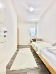 Postel nebo postele na pokoji v ubytování Apartman Niko