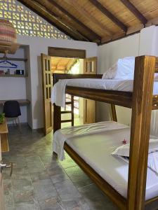 Postel nebo postele na pokoji v ubytování La Villa Ecofinca