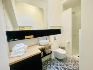 a bathroom with a sink and a toilet at Studio Calme Coeur Historique in Tours