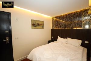Katil atau katil-katil dalam bilik di Giza Inn view