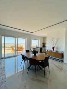 a kitchen and dining room with a table and chairs at Rooftop Galatina in Galatina