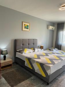 Ένα ή περισσότερα κρεβάτια σε δωμάτιο στο Mandic Apartment