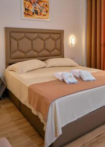 Giường trong phòng chung tại Hotel Center Park