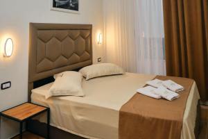 Giường trong phòng chung tại Hotel Center Park