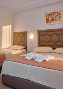Giường trong phòng chung tại Hotel Center Park