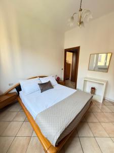 a bedroom with a large bed in a room at House near Milano in Cologno Monzese