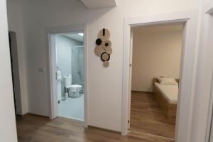 a room with a hallway with a room with a toilet at Milenkovic Apartments in Gevgelija