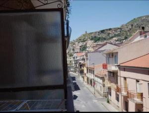a view of a city street from a balcony at La Spagnola Affittacamere in Amantea