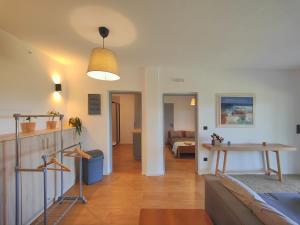 a living room with a couch and a table at Paradiso Apartments New Luxury Flat in Ayios Nikolaos Sithonia