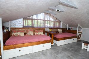 a bedroom with two beds and a window at River Home in Kʼaghsi +87 photos