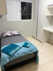 En eller flere senge i et værelse på Apartamento Completo Rio Verde