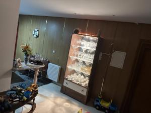 a room with a display case with toys in it at VACANCE a MAHDIA in Bin Rhilouf