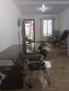 a room with chairs and a table and windows at Vicenzo in Melo +5 photos