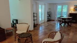 a living room with chairs and a table at Bastide la Bohême in La Ciotat