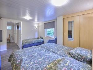 a bedroom with two beds and a room with a bed sqor at Zonnestroom in Meijel