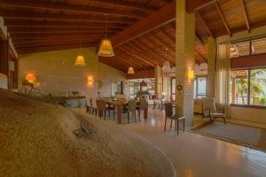 a large room with a kitchen and a dining room at Villa Bermahe in Ilhabela