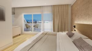 Postel nebo postele na pokoji v ubytování Reva Hotel TAHITI