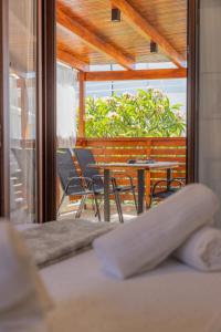 a room with chairs and a table and a window at The Neo-Classic Loft in Rhodes Town