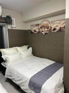 Postel nebo postele na pokoji v ubytování メルシアターリゾート3