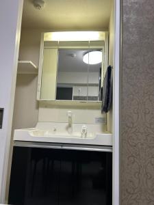 Koupelna v ubytování メルシアターリゾート3