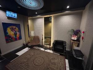 TV a/nebo společenská místnost v ubytování メルシアターリゾート3