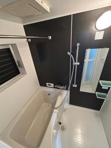 Koupelna v ubytování メルシアターリゾート3