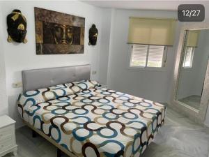 Ένα ή περισσότερα κρεβάτια σε δωμάτιο στο Apartamento centro Zahara Aretusa-luz