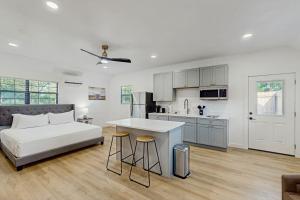 a bedroom with a bed and a kitchen with a table at Hilltop Getaway in Fredericksburg +11 photos
