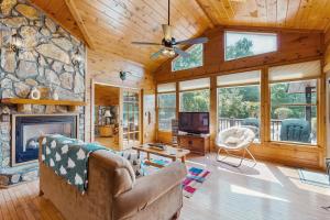 a living room with a couch and a fireplace at Time Out in Blue Ridge