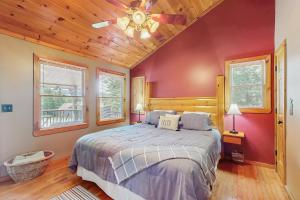a bedroom with a bed with a wooden ceiling at Time Out in Blue Ridge