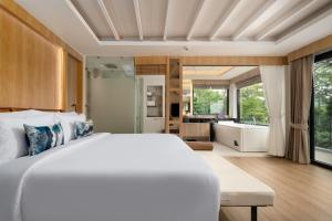 Voodi või voodid majutusasutuse Centara Villas Phi Phi Island toas