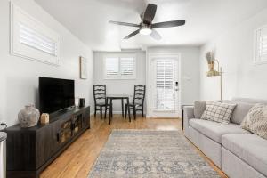 a living room with a couch and a ceiling fan at Mountain View Apartment in North Fork