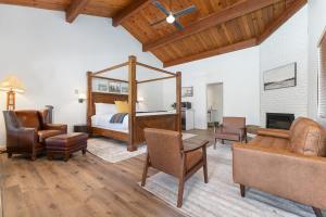 a bedroom with a bed and a living room with furniture at Camp Nelson Lodge Room 10 in Ponderosa