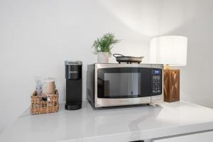 a microwave sitting on top of a kitchen counter at Mountain Nook CN Lodge #4 in Ponderosa