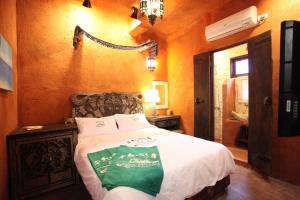 Postel nebo postele na pokoji v ubytování Jialeshuel Surf house B&B