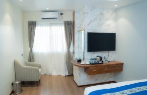 TV in/ali zabaviščno središče v nastanitvi Hotel Smart Durbar