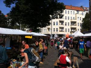 a crowd of people walking around an outdoor market at Freedom Studio Apartment in Berlin